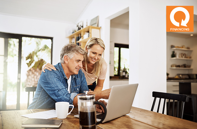 woman and man apply for application on computer which on kitchen table